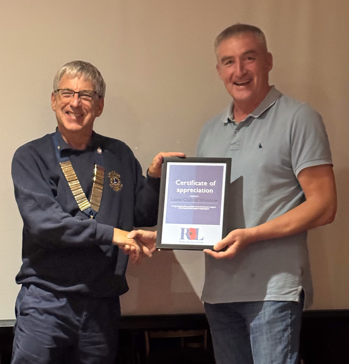 Lion President being awarded a Certificate of Appreciation for assistance with the Remembrance Parades